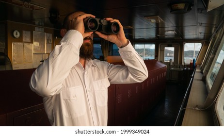 Navigational Merchant Officer Watching With Binocular During The Sea Passage.