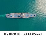 Navy aircraft carrier on the open sea Aerial top view of battleship, Military sea transport, Military Navy Rescue Helicopter on board the battleship deck 