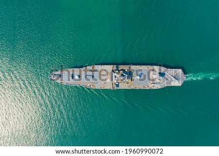 Navy aircraft carrier on the open sea Aerial top view of battleship, Military sea transport, Military Navy Rescue Helicopter on board the battleship deck 