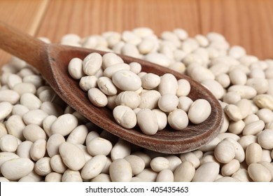 Navy Beans In Wooden Spoon