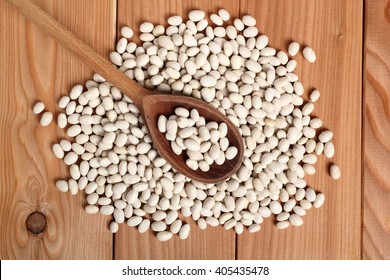 Navy Beans In Wooden Spoon