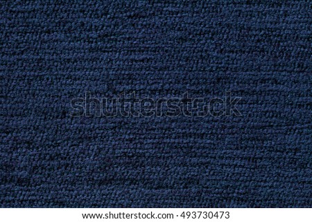 Navy blue background from a soft textile material. sheathing fabric with natural texture. Cloth backdrop.