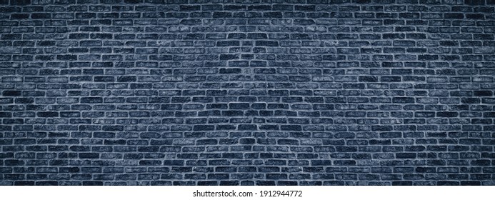 Navy blue brick wall wide texture. Indigo masonry large long background. Gloomy dark color brickwork backdrop