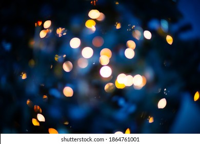 Navy Blue Color Blurred Background With Shiny Gold Garland Lights, Winter Holiday Greeting Card, Mock Up