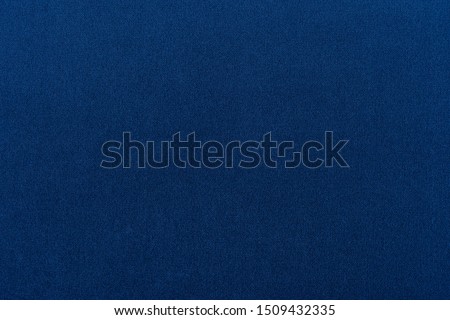 Navy blue dark fabric texture background top view banner. Classic blue cloth empty canvas, seamless casual fashion clothes material, flat lay wallpaper or banner of vibrant blue surface
