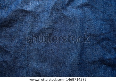 Navy blue fabric texture background top view. Crumpled Cloth Blank Background