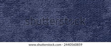 Navy blue fluffy background of soft, fleecy cloth. Texture of textile closeup.