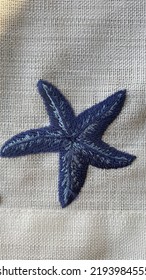 Navy Blue Sea Star Embroidery On Beige Etamine Fabric, Flat Lay