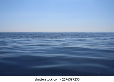 Navy Blue Sea Surface And Blue Sky