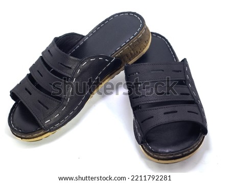 navy blue womne's slippers on the white background, close up, 
