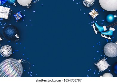 Navy Christmas Borders Background. Elegant Blue Background With Shiny Christmas Decorations And Copy Space.