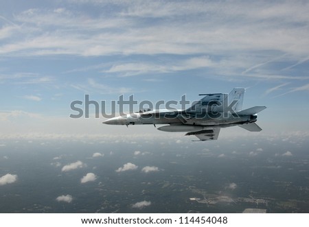 Navy jetfighter flying at high altitude