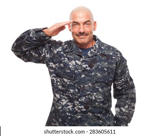 Navy Sailor Or Chief Grinning While Saluting On White Background.