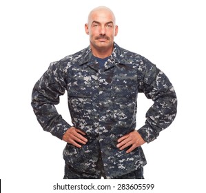 Navy Sailor Or Chief Looking Serious On White Background.