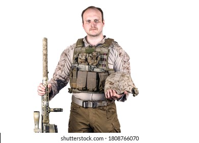 Navy Seal Veteran Portrait. Middle Aged Officer Posing In Front Of Camera With His Sniper Rifle And Battle Helmet. He Is Wearing Desert Uniform And Bulletproof Vest. Isolated, White Background.