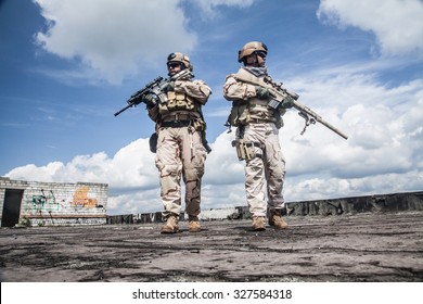 Navy SEALs Team With Weapons In Action 