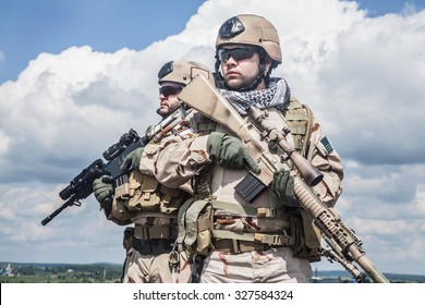 Navy SEALs Team with weapons in action 