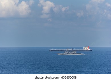 Navy Ship Escorts Oil Tanker. Navy Convoy