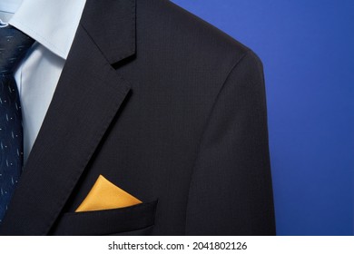    Navy Men’s Suit. The Jacket With Sky-blue Shirt, Blue Tie And Yellow Silk Pocket Square.                            