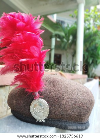 NCC cap having a hacle and NCC logo