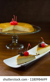 Neapolitan Flan Decorated With Cherry And Chocolate On Glass Base