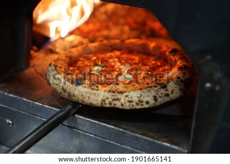 Neapolitan pepperoni pizza in wood-fired oven