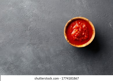 Neapolitan Tomato Sauce For Pasta Or Pizza In A Wooden Bowl On A Dark Background. Top View.