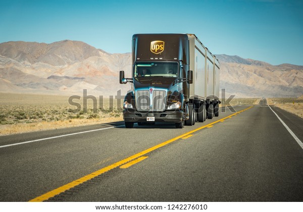 Near Bishop,\
California / USA - March 2018: United Parcel Service (UPS) truck on\
Interstate in the American\
West\
