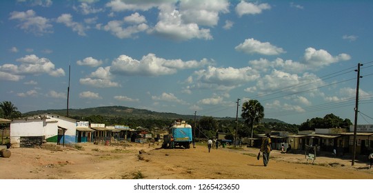 Near Chengi, Zambia, 11th June 2005: People Walking By The Road During A Bus Pitstop