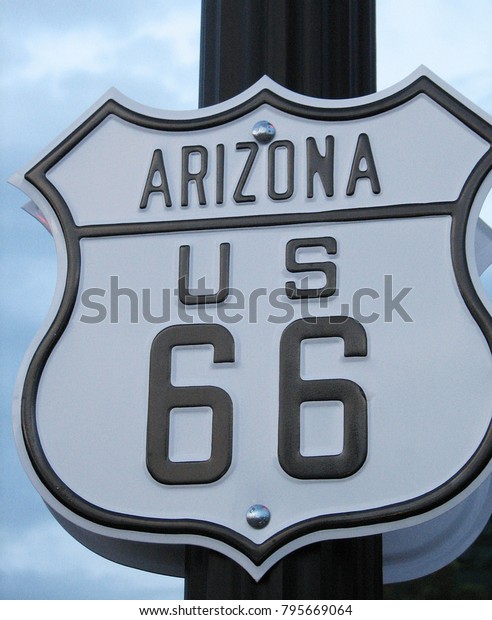 Near city of Flagstaff, Arizona\
(America) - August 7, 2005: road sign : Arizona, route\
66.\
