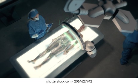 In the Near Future: Female Doctor uses Full Body Anatomy Futuristic High Tech Medical Augmented Reality Scanner on Female Patient Laying on Holographic Bed with Light Showing Skeleton - Powered by Shutterstock