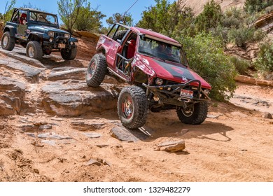 Near Moab, Utah, USA - 5/26/17 A Modified Toyota Pick-up Truck On Sandstone