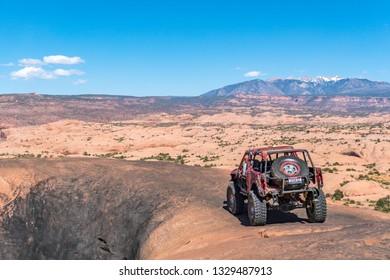 Near Moab, Utah, USA - 5/26/17 A Modified Toyota Pick-up Truck On Sandstone