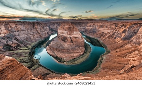 Near Page, Arizona, is a stunning horseshoe-shaped meander of the Colorado River. This iconic natural wonder, part of the Glen Canyon National Recreation Area, offers breathtaking views. - Powered by Shutterstock