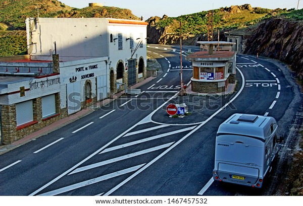 Near Roses,\
Spain. Border post on coastal road between France and Spain. Now\
closed. Custom, passport check point in centre of road. Admin\
buildings and shops roadside.. Now closed.\
