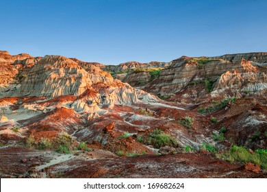 Near Sunset Over The Drumheller Badlands At The Dinosaur Provincial Park In Alberta, Where Rich Deposits Of Fossils And Dinosaur Bones Have Been Found. The Park Is Now An UNESCO World Heritage Site.