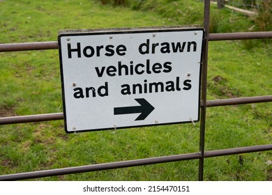 Near Walltown, Northumberland, UK - May 7th, 2022: A sign next to a cattle grid diverting horse drawn vehicles and animals - an indicator of the countryside.