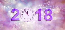 Nearly Happy New Year 2018 - A Clock Face Showing 11.55 Making The 0 Of 2018 On A Sparkling Pink Bokeh Background

