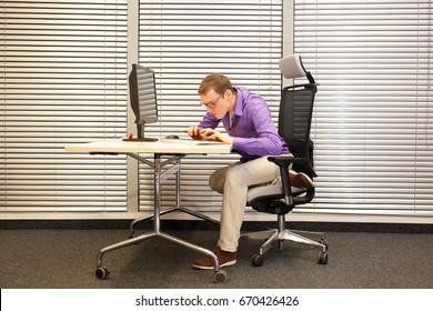  Near-sightedness, Myopia. Caucasian Office Worker At Work Station