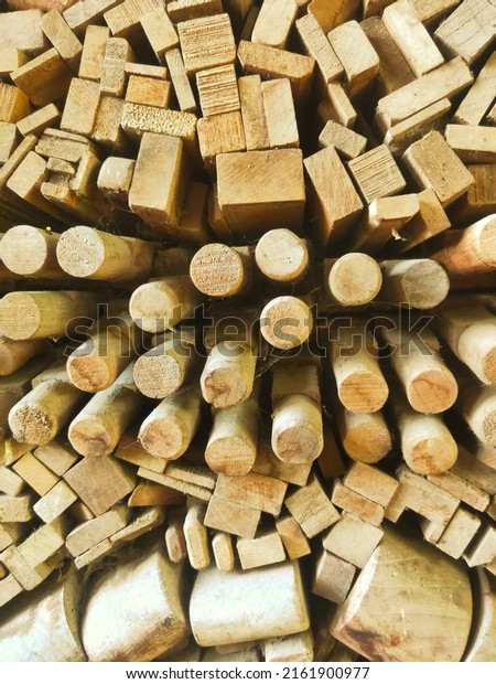 a neat arrangement of wood as a room divider\
and background