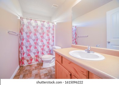 Neat Clean Bathroom With Closed Shower Curtain