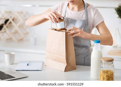 Neat Hostess Unpacking After Shopping