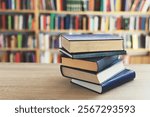 Neatly arranged books. Most shelves in libraries have books arranged by height, subject or genre, with clear markings on the spine of the book (numbers, codes or labels). Libraries are quiet places