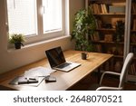 A neatly arranged home office includes a laptop, documents, and a coffee cup on a wooden desk, illuminated by natural light from a nearby window and surrounded by plants.