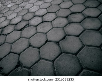 A neatly arranged path of stepping stones leads through a serene setting. Each stone is placed with care, creating a charming and inviting route through lush greenery or a tranquil garden. - Powered by Shutterstock