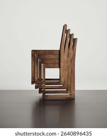 Neatly arranged row of rustic wooden chairs for stylish and functional seating in a cozy and inviting space  