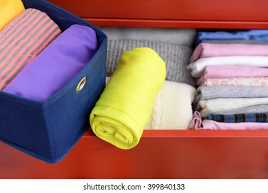 Neatly Folded Clothes In Open Drawer, Close Up