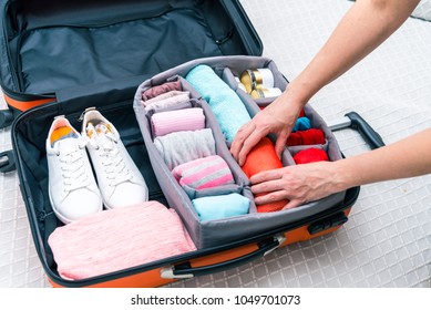 Neatly Folded Clothes In A Suitcase