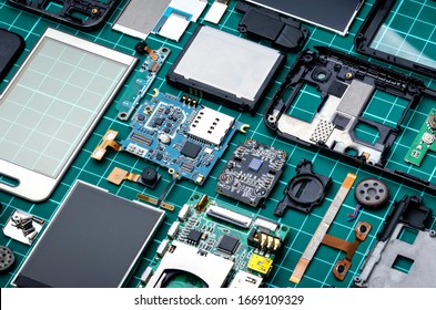 Neatly laid out mobile phone parts close-up