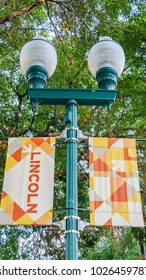 Nebraska, USA - Aug 8, 2017: Closeup View Of A Street Lamp Post In Lincoln, Which Has A Retro Design Look Complete With Promotional Banners.